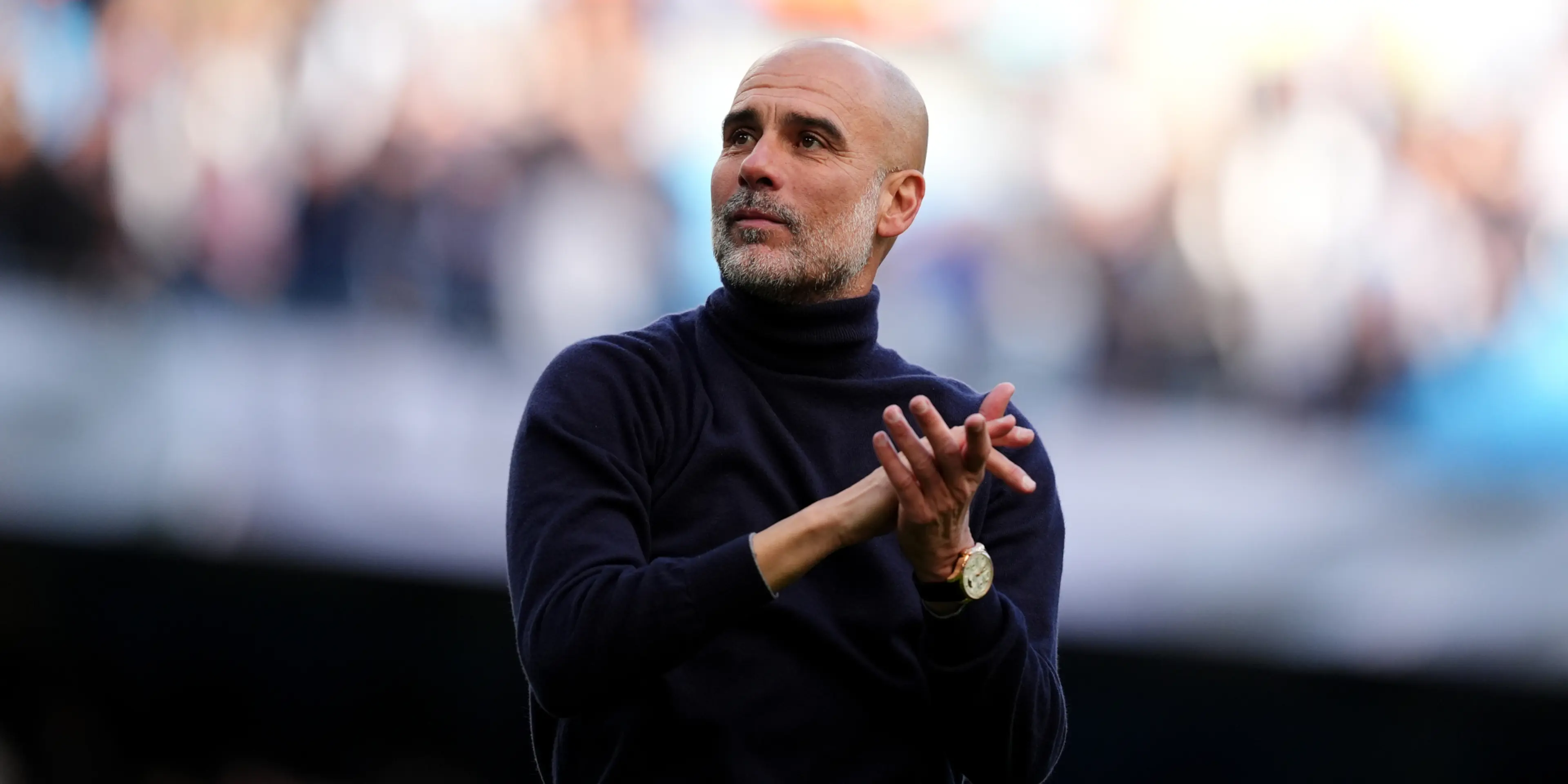 Guardiola warns title not won yet as Man City hunt down Arsenal