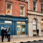 imgi_49_bank-of-ireland-branch-on-merrion-row-dublin-with-red-brick-facade-and-people-on-the-street